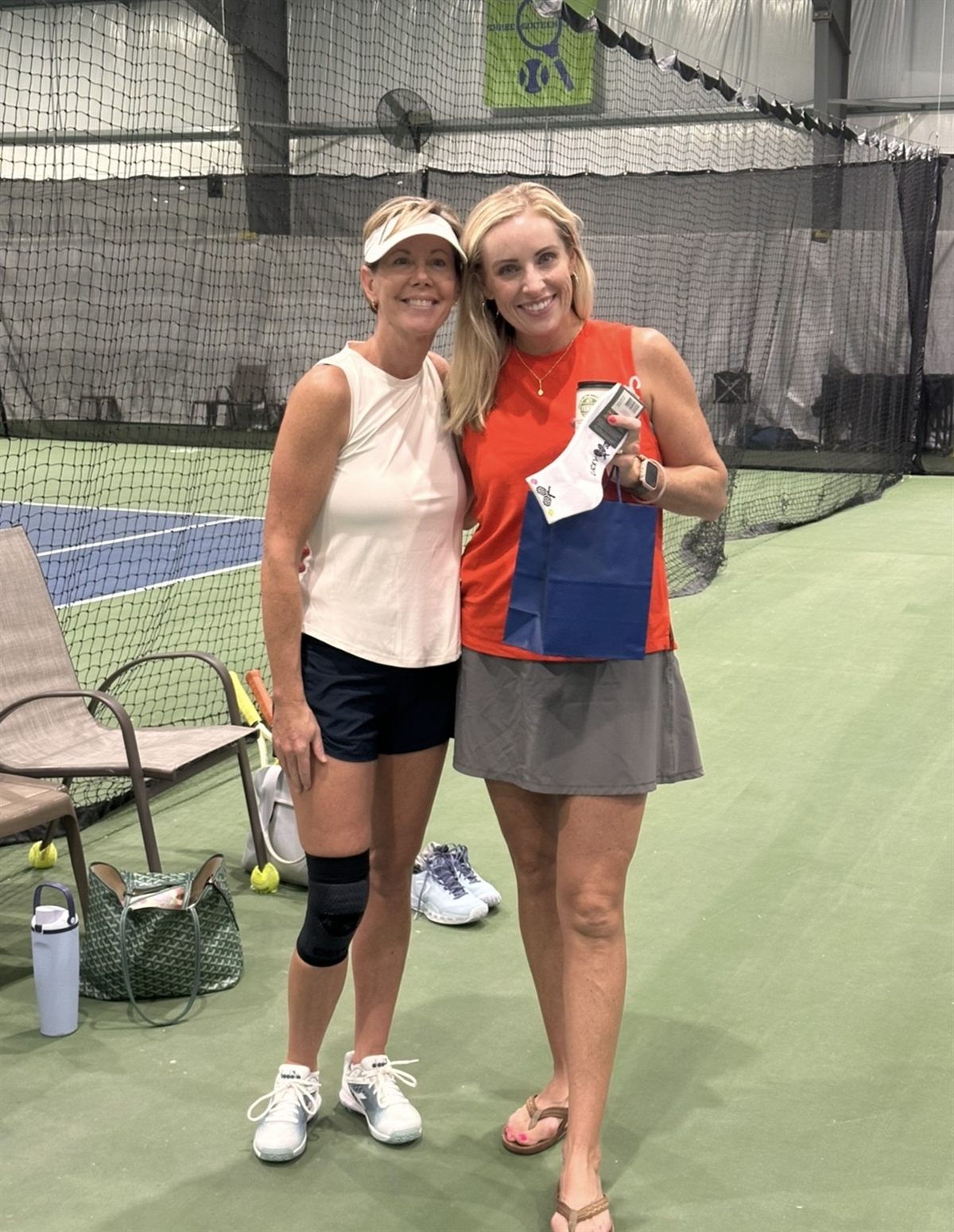 Two members courtside after a match