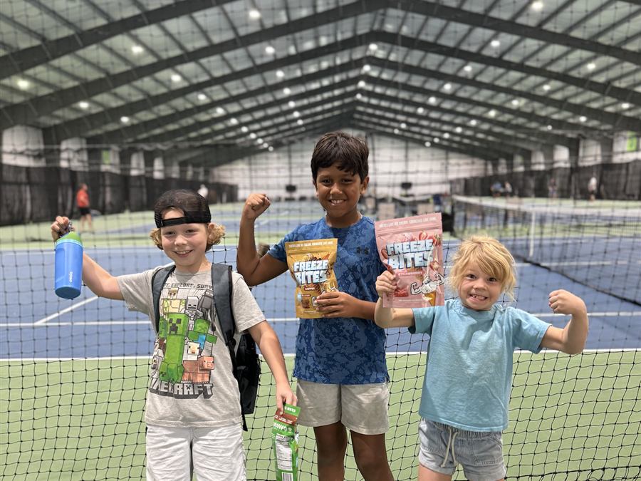 Young players on court after a junior session